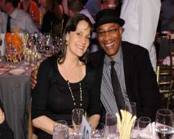 Joe Morton consuming alcohol